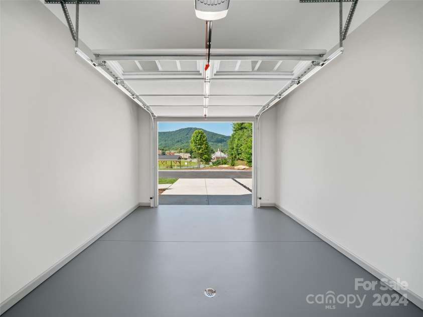 200 Red Twig Lane, Burnsville, NC 28714.  MLS# CAR4167529, YatesRealty ID 10723. One Car garage with Utility Room to rear with ample extra storage space