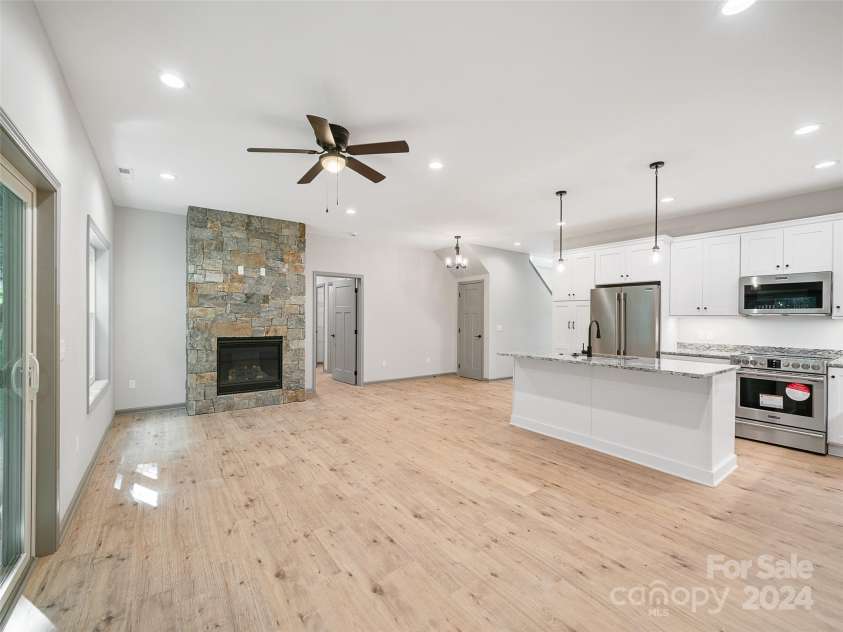 200 Red Twig Lane, Burnsville, NC 28714.  MLS# CAR4167529, YatesRealty ID 10723. Open Floor plan Large great room and kitchen, natural vented gas fireplace  with rockwork and tv and power connection within