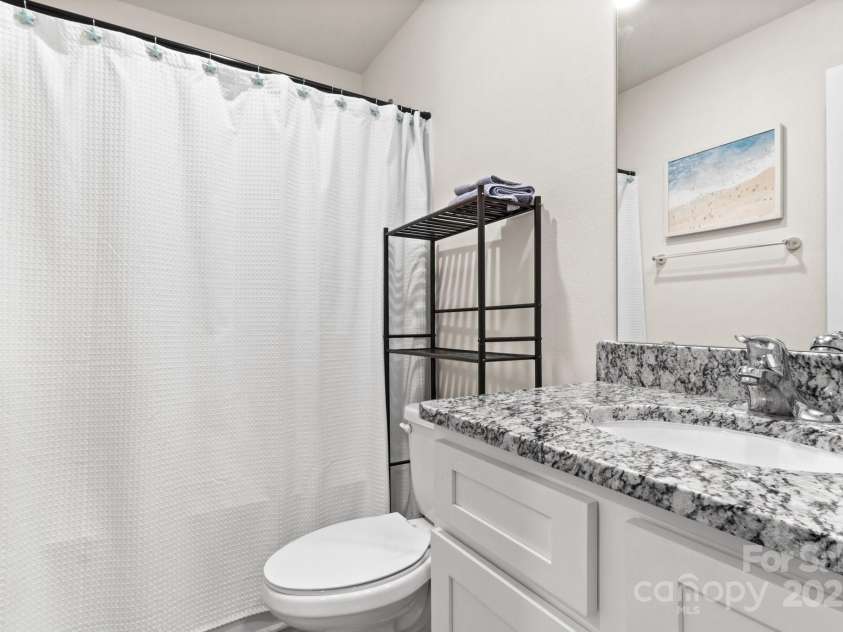 324 Aniston Lane, Shelby, NC 28152.  MLS# CAR4227228, YatesRealty ID 10727. Second full bath with bathtub and granite countertops.