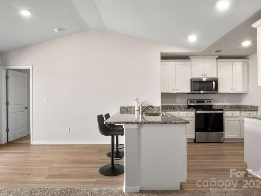 324 Aniston Lane, Shelby, NC 28152.  MLS# CAR4227228, YatesRealty ID 10727. View from family room to kitchen/dining area.