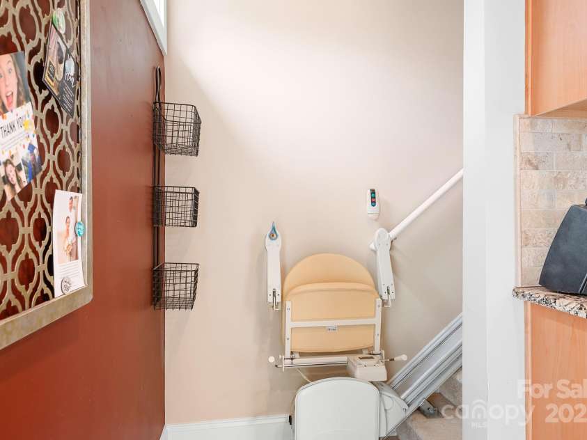 14541 Holly Springs Drive, Huntersville, NC 28078.  MLS# CAR4247448, YatesRealty ID 10760. Chair lift to upper level Primary Bedroom. Can be removed.