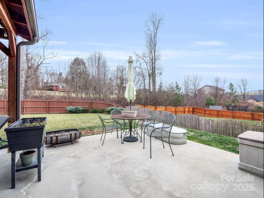 8 Mallard Run Drive, Arden, NC 28704.  MLS# CAR4238190, YatesRealty ID 10764. Additional open patio space allows sunlight for spring and summer gardening.