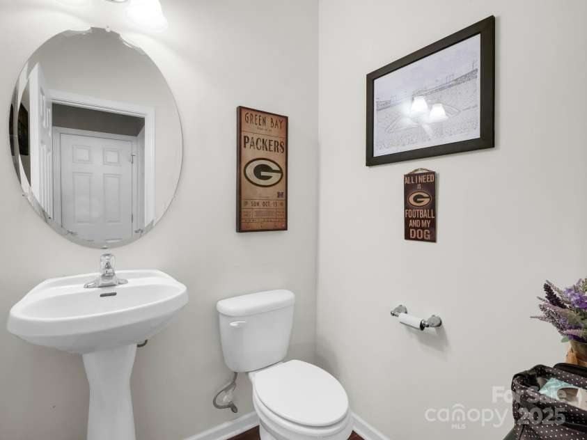 8 Mallard Run Drive, Arden, NC 28704.  MLS# CAR4238190, YatesRealty ID 10764. Half guest bath on main level.