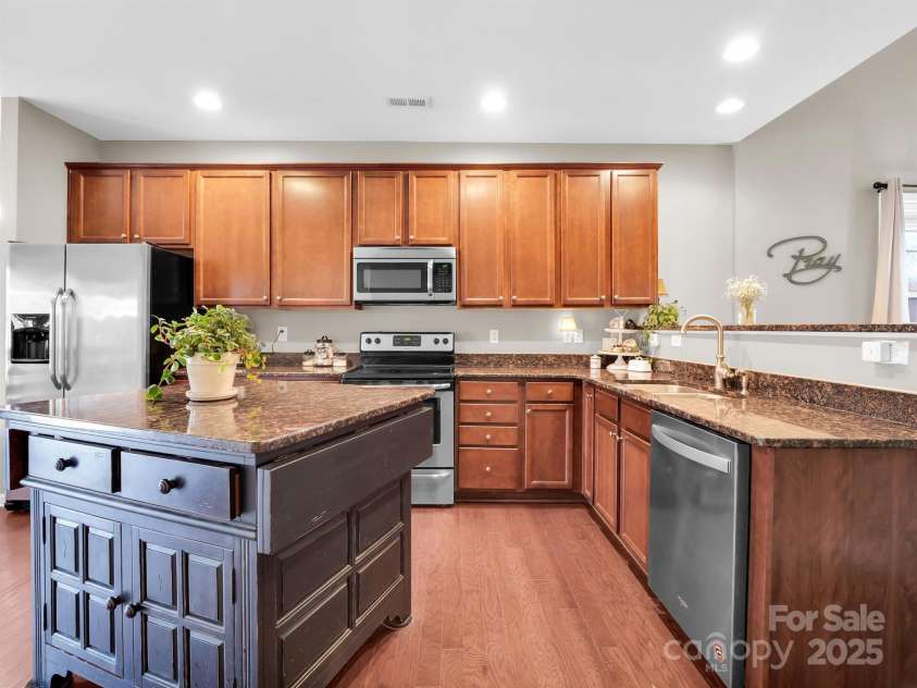 8 Mallard Run Drive, Arden, NC 28704.  MLS# CAR4238190, YatesRealty ID 10764. Kitchen island with breakfast bar.