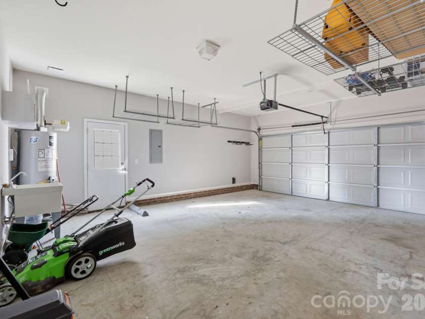 197 Roanoke Road, Fletcher, NC 28732.  MLS# CAR4399484, YatesRealty ID 10767. This garage has so much space for cars, storage and hobbies.