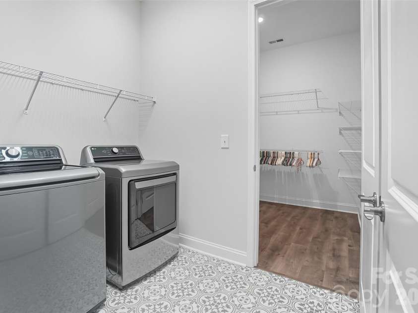 219 Pintail Drive, Monroe, NC 28110.  MLS# CAR4301611, YatesRealty ID 10768. Laundry room with access to the primary walk in closet