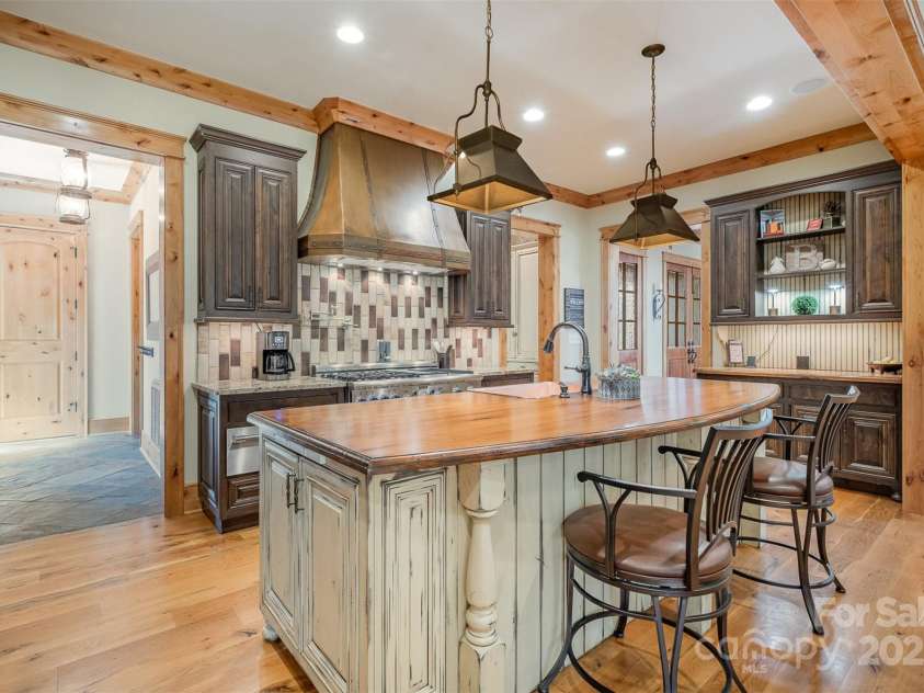 751 Mendenhall Court, Fort Mill, SC 29715.  MLS# CAR4239100, YatesRealty ID 10770. Amazing custom island with view to garage entry