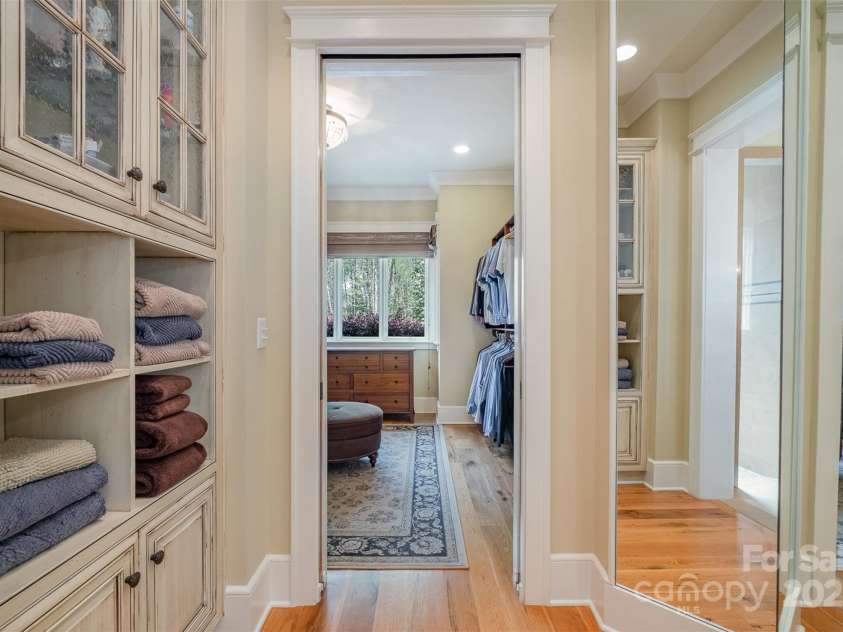 751 Mendenhall Court, Fort Mill, SC 29715.  MLS# CAR4239100, YatesRealty ID 10770. Cabinets and 3-sided changing mirror leads into primary closet