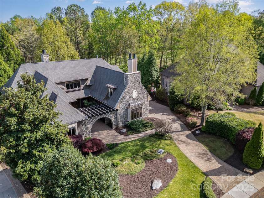 751 Mendenhall Court, Fort Mill, SC 29715.  MLS# CAR4239100, YatesRealty ID 10770. Drone of front entry on 11th hole of golf course