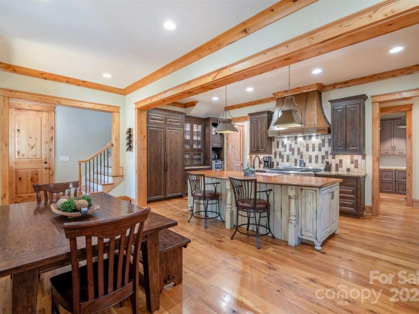 751 Mendenhall Court, Fort Mill, SC 29715.  MLS# CAR4239100, YatesRealty ID 10770. Kitchen featuring Copper hood and island seating