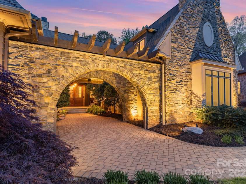 751 Mendenhall Court, Fort Mill, SC 29715.  MLS# CAR4239100, YatesRealty ID 10770. Majestic Courtyard with double stone arches