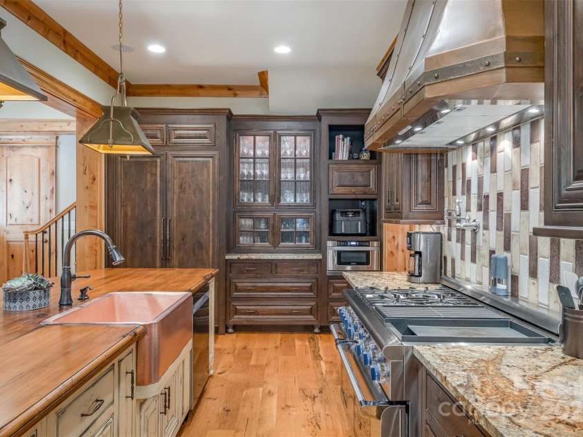 751 Mendenhall Court, Fort Mill, SC 29715.  MLS# CAR4239100, YatesRealty ID 10770. Panelled Thermador refrigerator/freezer & blue knob Professional Thermador range with warming drawer