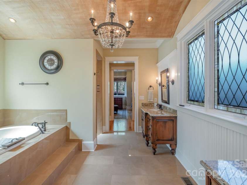 751 Mendenhall Court, Fort Mill, SC 29715.  MLS# CAR4239100, YatesRealty ID 10770. Primary Bath, tub with copper-color arched ceiling