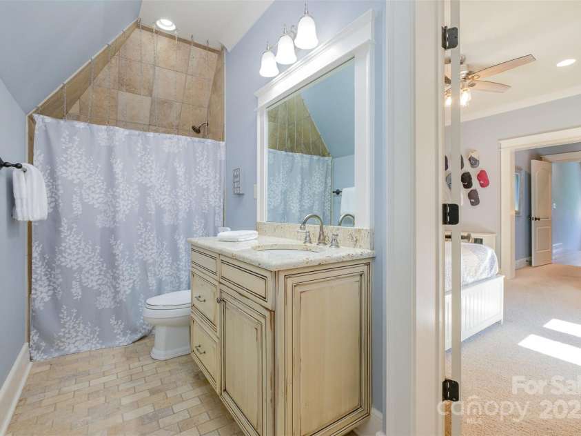 751 Mendenhall Court, Fort Mill, SC 29715.  MLS# CAR4239100, YatesRealty ID 10770. Queen ensuite with unique curtain hanger