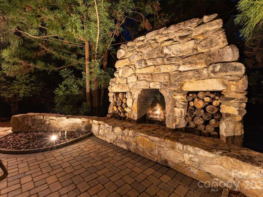 751 Mendenhall Court, Fort Mill, SC 29715.  MLS# CAR4239100, YatesRealty ID 10770. Stately stone Fireplace in backyard