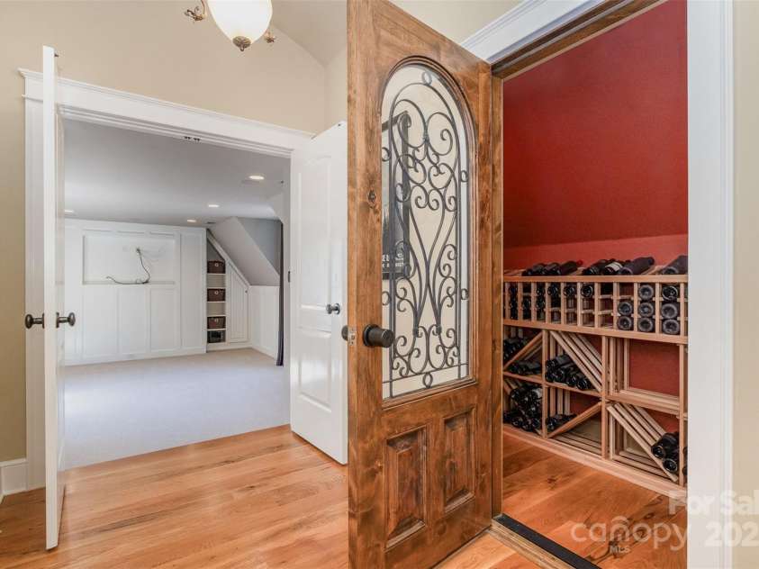 751 Mendenhall Court, Fort Mill, SC 29715.  MLS# CAR4239100, YatesRealty ID 10770. Wine Cellar with combo lock at entry to theatre