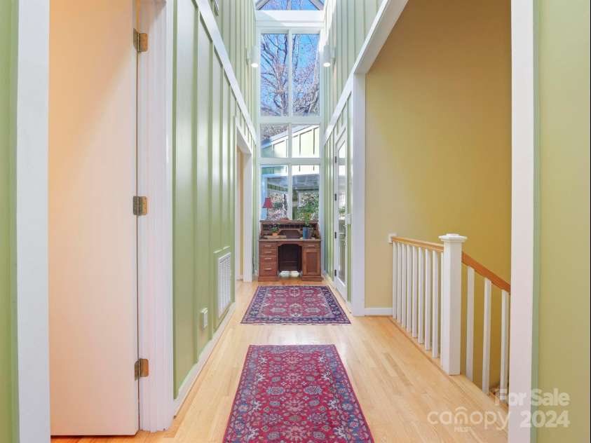 78 Assembly Drive, Flat Rock, NC 28731.  MLS# CAR4084810, YatesRealty ID 10772. Front door on the far right and view of the Foyer.