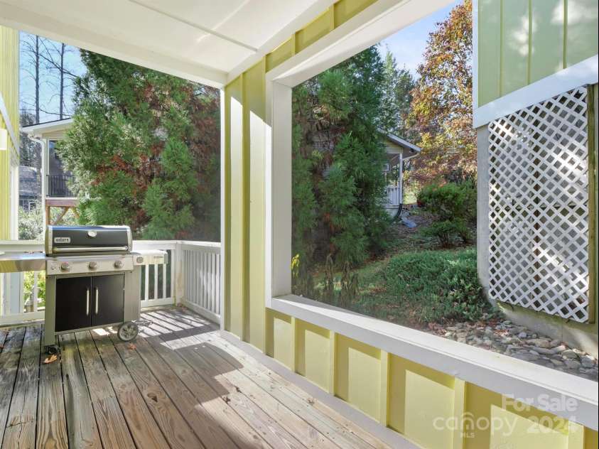 78 Assembly Drive, Flat Rock, NC 28731.  MLS# CAR4084810, YatesRealty ID 10772. Lower level front porch with plumbed gas for the grill.