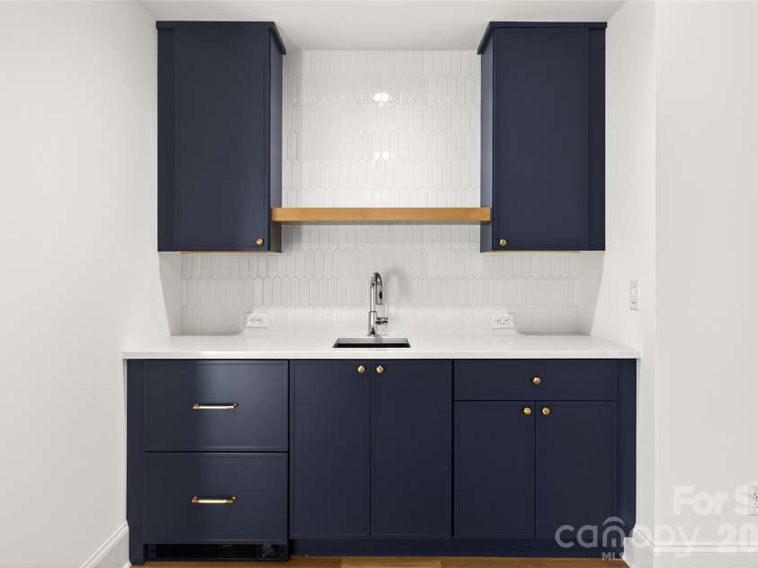 1316 Holmes Drive, Charlotte, NC 28209.  MLS# CAR4338664, YatesRealty ID 10773. 3rd Level. Wet Bar. Sink. Refrigerator drawer and ice drawer, left-hand pullout drawers.