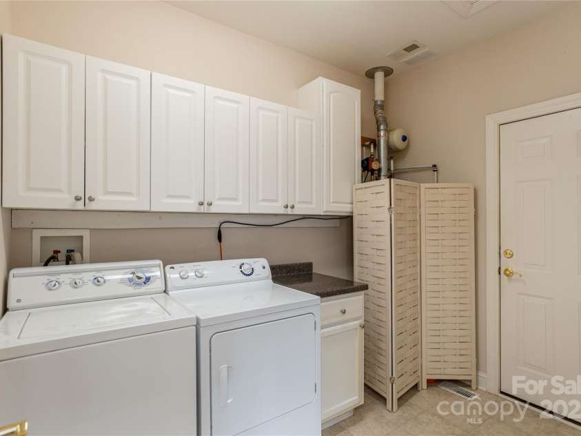 6 Stepping Stone Lane, Flat Rock, NC 28731.  MLS# CAR4251923, YatesRealty ID 10778. Laundry room leading to garage