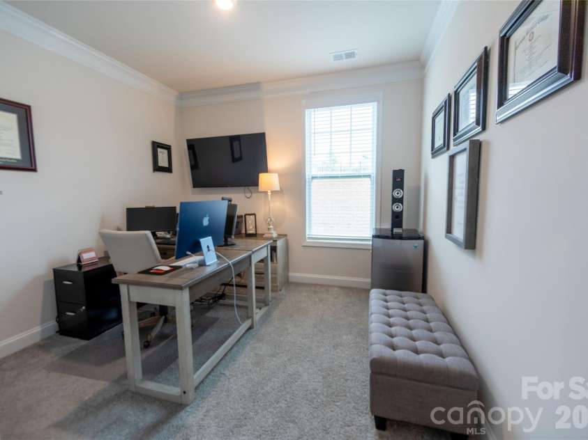 151 Aviendha Lane, Troutman, NC 28166.  MLS# CAR4347139, YatesRealty ID 10783. Main-level bedroom currently utilized as a home office.
