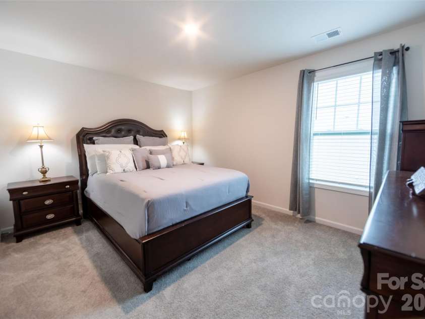 151 Aviendha Lane, Troutman, NC 28166.  MLS# CAR4347139, YatesRealty ID 10783. Upper-level bedroom with ample closet space.