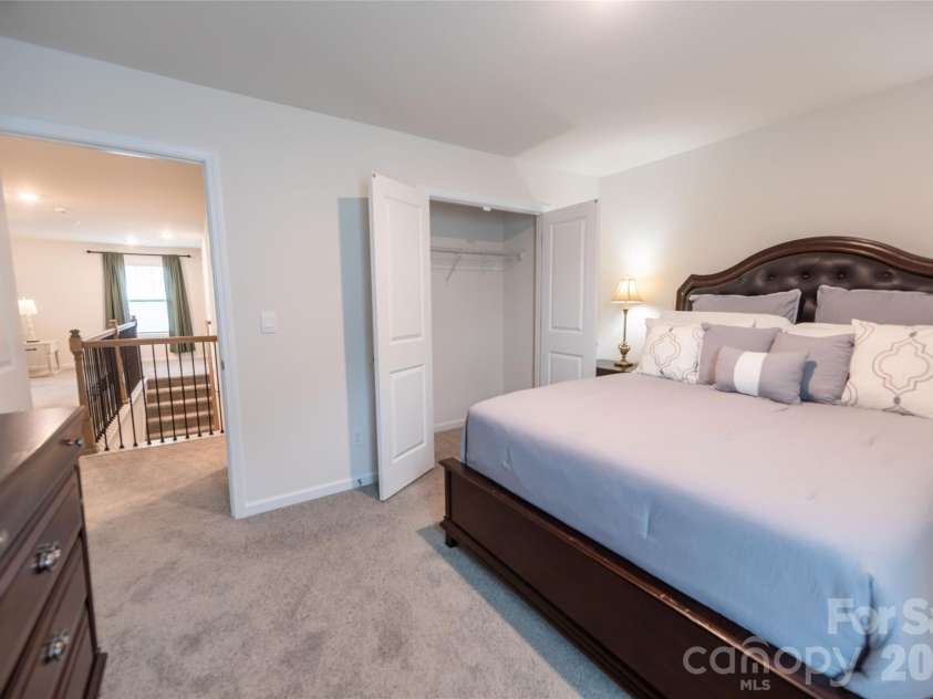 151 Aviendha Lane, Troutman, NC 28166.  MLS# CAR4347139, YatesRealty ID 10783. Upper-level bedroom with ample closet space.