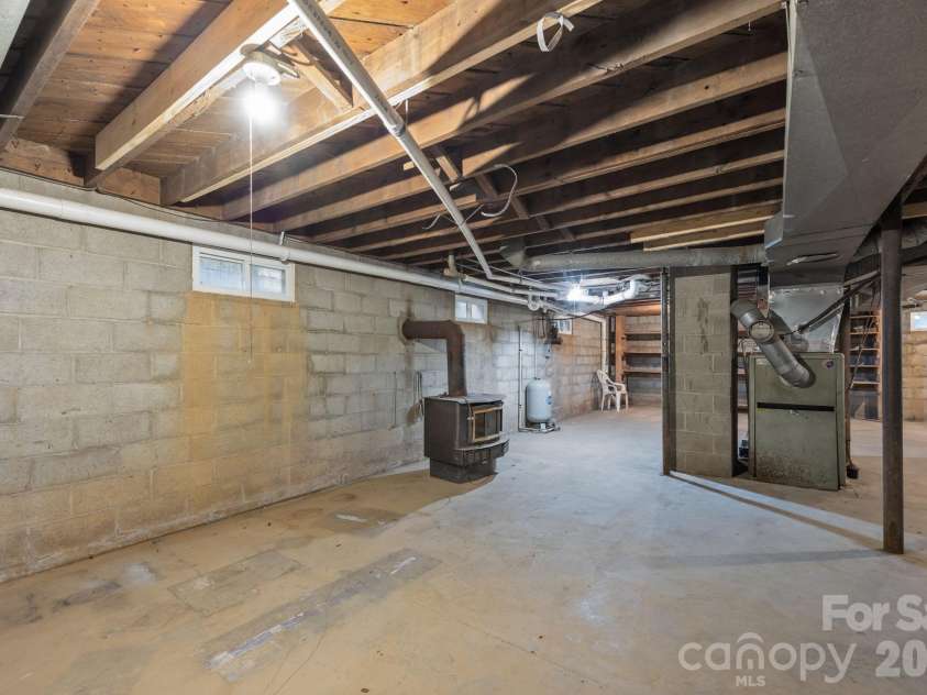 82 Greasy Cove Road, Leicester, NC 28748.  MLS# CAR4330062, YatesRealty ID 10795. Full Unfinished Basement