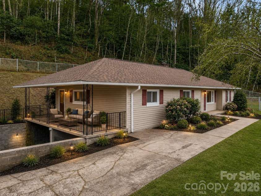 82 Greasy Cove Road, Leicester, NC 28748.  MLS# CAR4330062, YatesRealty ID 10795. Virtual landscape and patio seating area