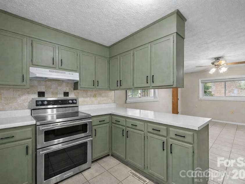 82 Greasy Cove Road, Leicester, NC 28748.  MLS# CAR4330062, YatesRealty ID 10795. Virtually Painted Cabinets and updated hardware