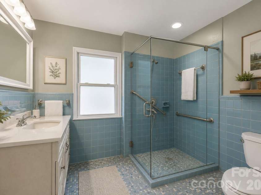 82 Greasy Cove Road, Leicester, NC 28748.  MLS# CAR4330062, YatesRealty ID 10795. Virtually updated bathroom