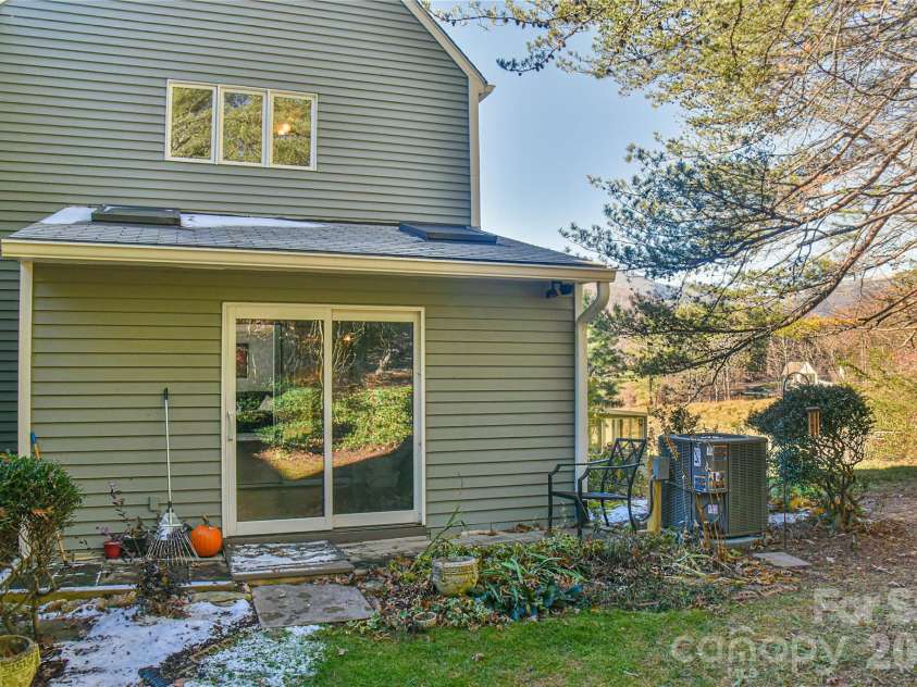 1 Lynx Drive, Black Mountain, NC 28711.  MLS# CAR4320026, YatesRealty ID 10799. Corner unit with back patio area and wooded backdrop. 