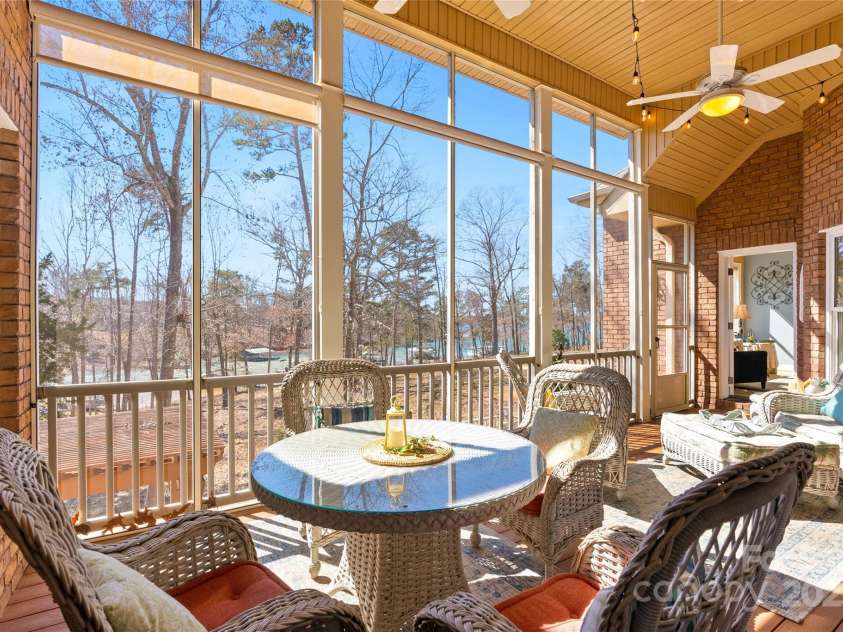 1201 Sunset Lane, Anderson, SC 29626.  MLS# CAR4224408, YatesRealty ID 1082. Screened deck overlooking the lake
