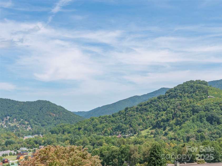 21 Flint Lane, Maggie Valley, NC 28751.  MLS# CAR4181508, YatesRealty ID 10824. Long Range Year Round Mountain Views of all 4 Seasons