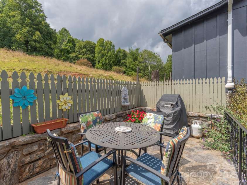 21 Flint Lane, Maggie Valley, NC 28751.  MLS# CAR4181508, YatesRealty ID 10824. Main Level Stone Patio for Outside Dining