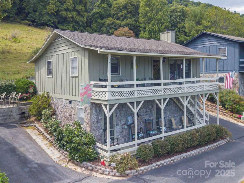 21 Flint Lane, Maggie Valley, NC 28751.  MLS# CAR4181508, YatesRealty ID 10824. Side View with back pasture view