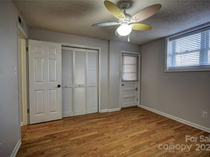 857 Country Club Drive, Maggie Valley, NC 28751.  MLS# CAR4240227, YatesRealty ID 10826. Bedroom 2 basement level with outside entrance
