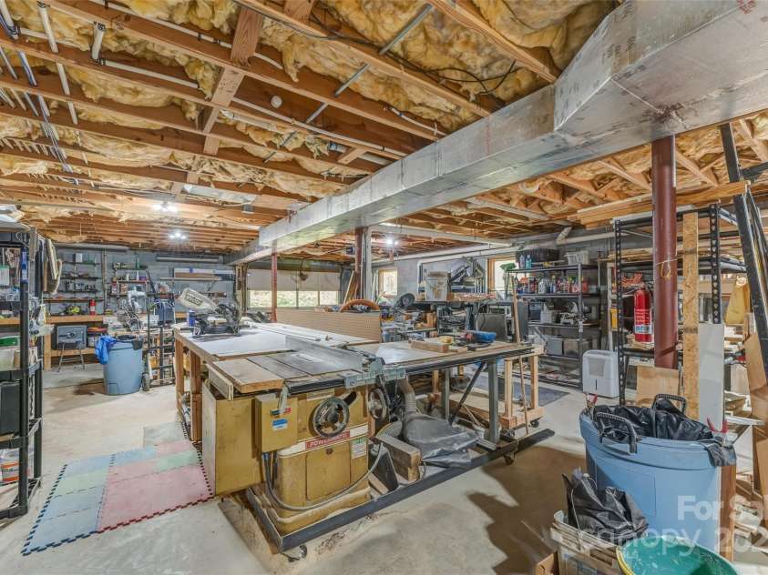 207 Kingfisher Road, Brevard, NC 28712.  MLS# CAR4253015, YatesRealty ID 10831. 2,300 sq. sf. basement with workshop.