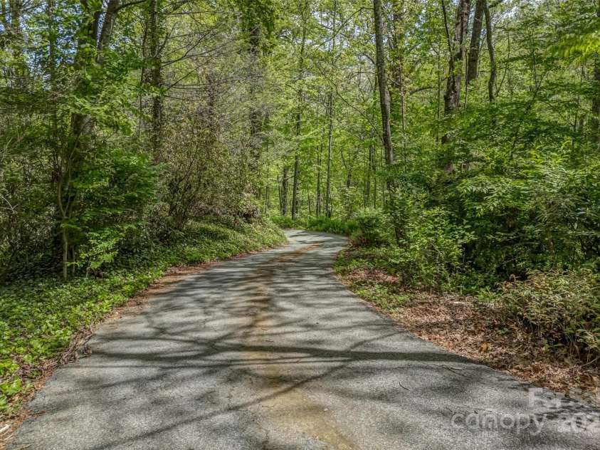 207 Kingfisher Road, Brevard, NC 28712.  MLS# CAR4253015, YatesRealty ID 10831. 300 foot driveway that leads to peace and comfort!