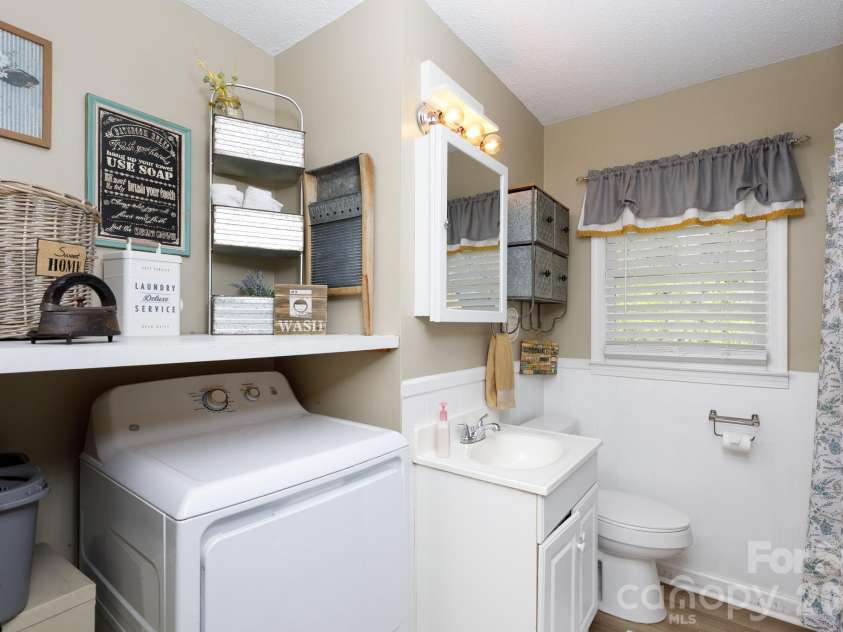 2640 Meadow Lark Lane, Gastonia, NC 28056.  MLS# CAR4364161, YatesRealty ID 10832. Laundry area w/ custom shelving