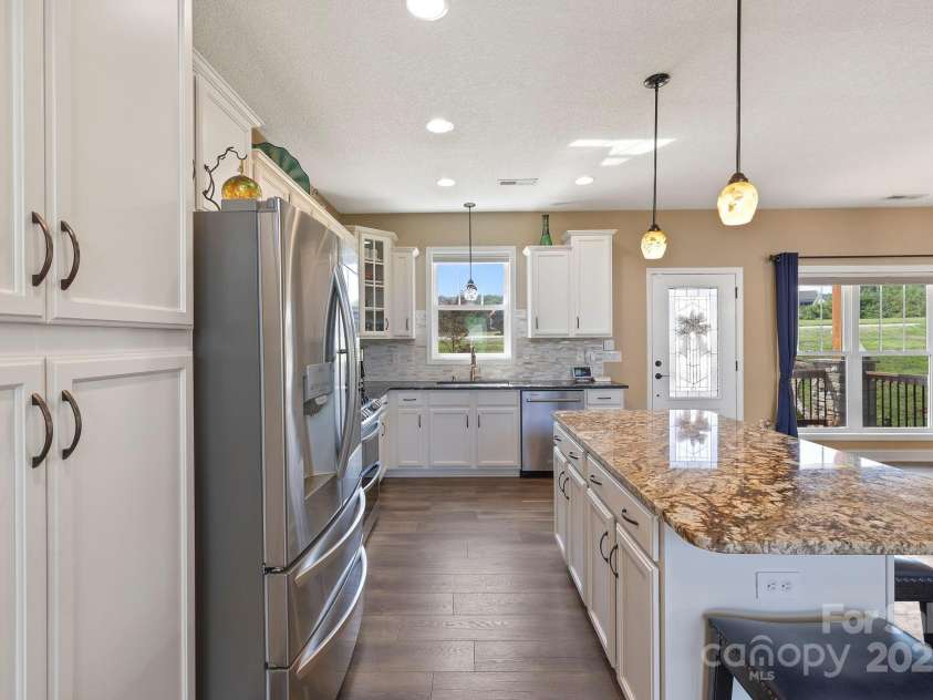 16 Enchanted Oak Lane, Alexander, NC 28701.  MLS# CAR4285091, YatesRealty ID 10833. Designer kitchen w/modern appliances