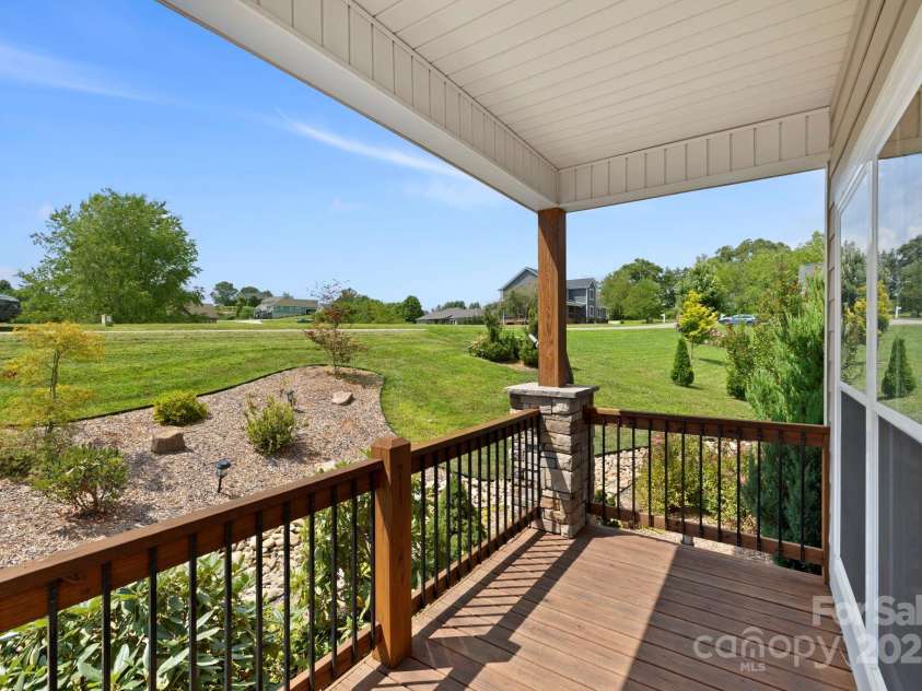 16 Enchanted Oak Lane, Alexander, NC 28701.  MLS# CAR4285091, YatesRealty ID 10833. Expansive scenic views from the deck