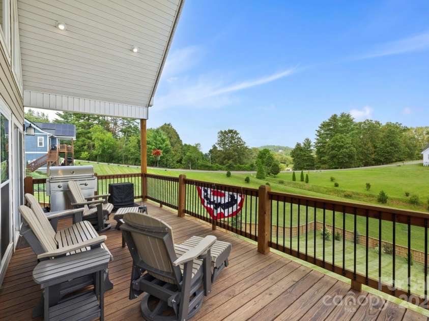 16 Enchanted Oak Lane, Alexander, NC 28701.  MLS# CAR4285091, YatesRealty ID 10833. Late afternoon relaxing deck views