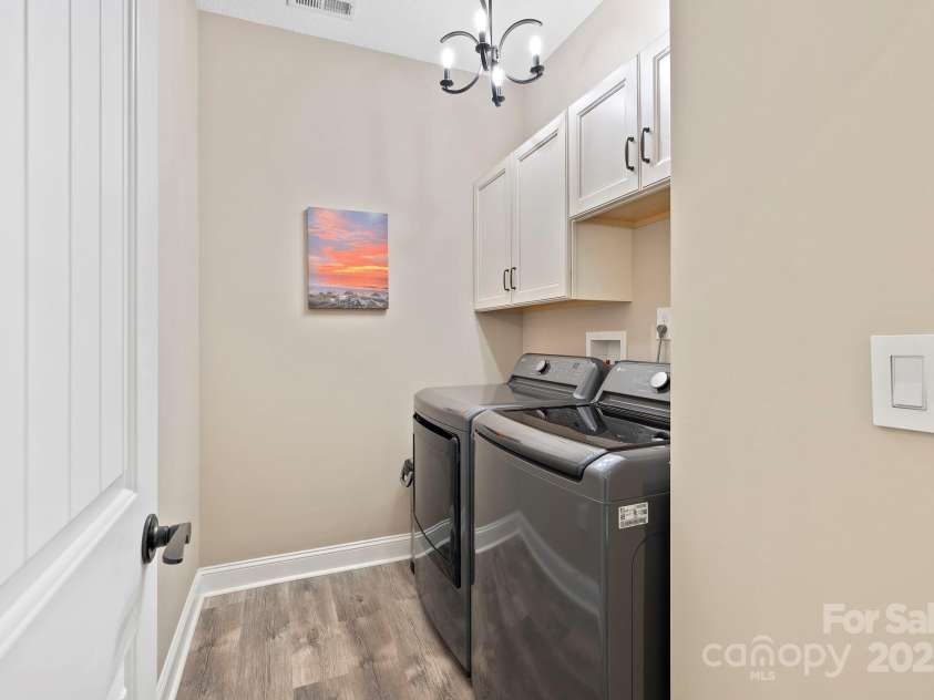 16 Enchanted Oak Lane, Alexander, NC 28701.  MLS# CAR4285091, YatesRealty ID 10833. Laundry room w/storage