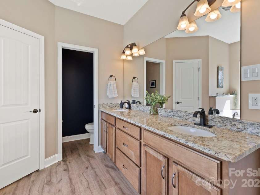 16 Enchanted Oak Lane, Alexander, NC 28701.  MLS# CAR4285091, YatesRealty ID 10833. Primary bathroom w/granite