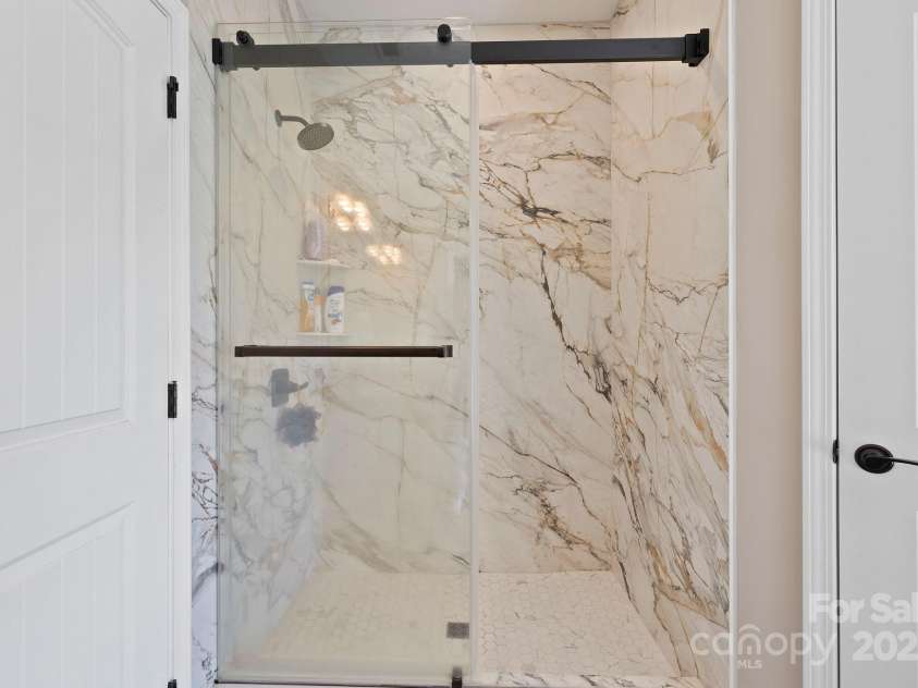 16 Enchanted Oak Lane, Alexander, NC 28701.  MLS# CAR4285091, YatesRealty ID 10833. Primary ensuite bathroom