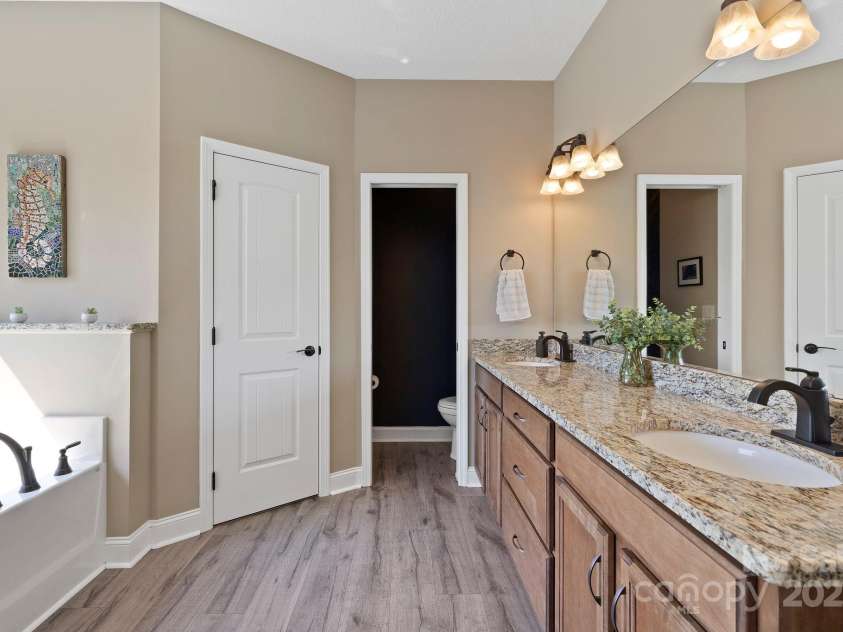 16 Enchanted Oak Lane, Alexander, NC 28701.  MLS# CAR4285091, YatesRealty ID 10833. Primary spa-like bathroom