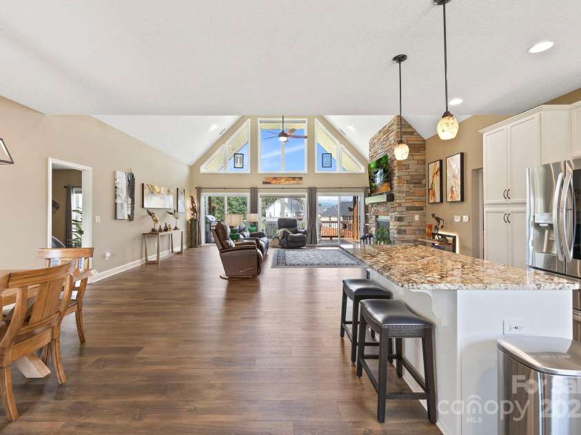 16 Enchanted Oak Lane, Alexander, NC 28701.  MLS# CAR4285091, YatesRealty ID 10833. View facing living room from kitchen