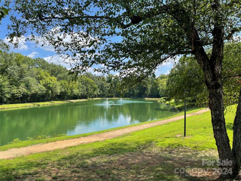 7201 Winery Lane, Charlotte, NC 28227.  MLS# CAR4174403, YatesRealty ID 1084. Pond with walking trail