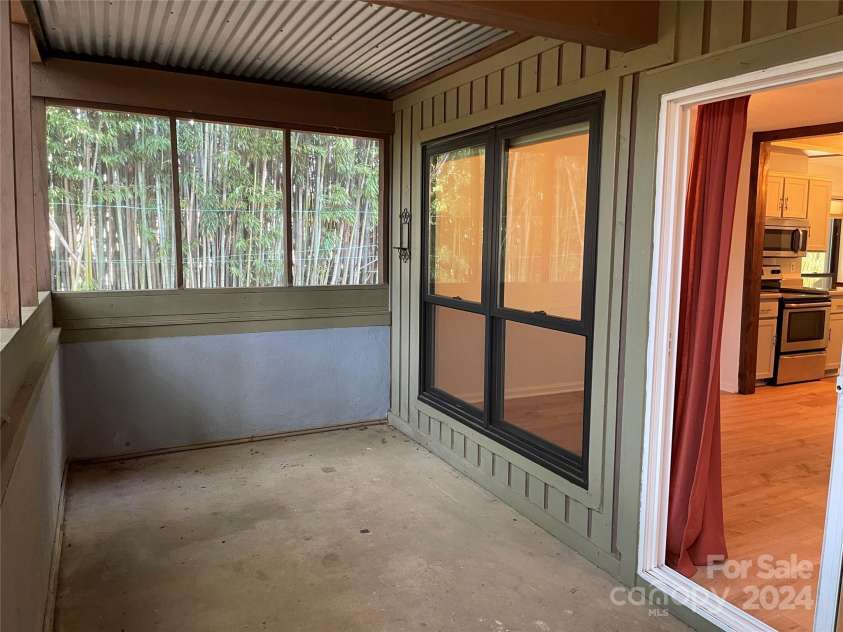 7201 Winery Lane, Charlotte, NC 28227.  MLS# CAR4174403, YatesRealty ID 1084. Screened in Porch/Patio which has a storage closet